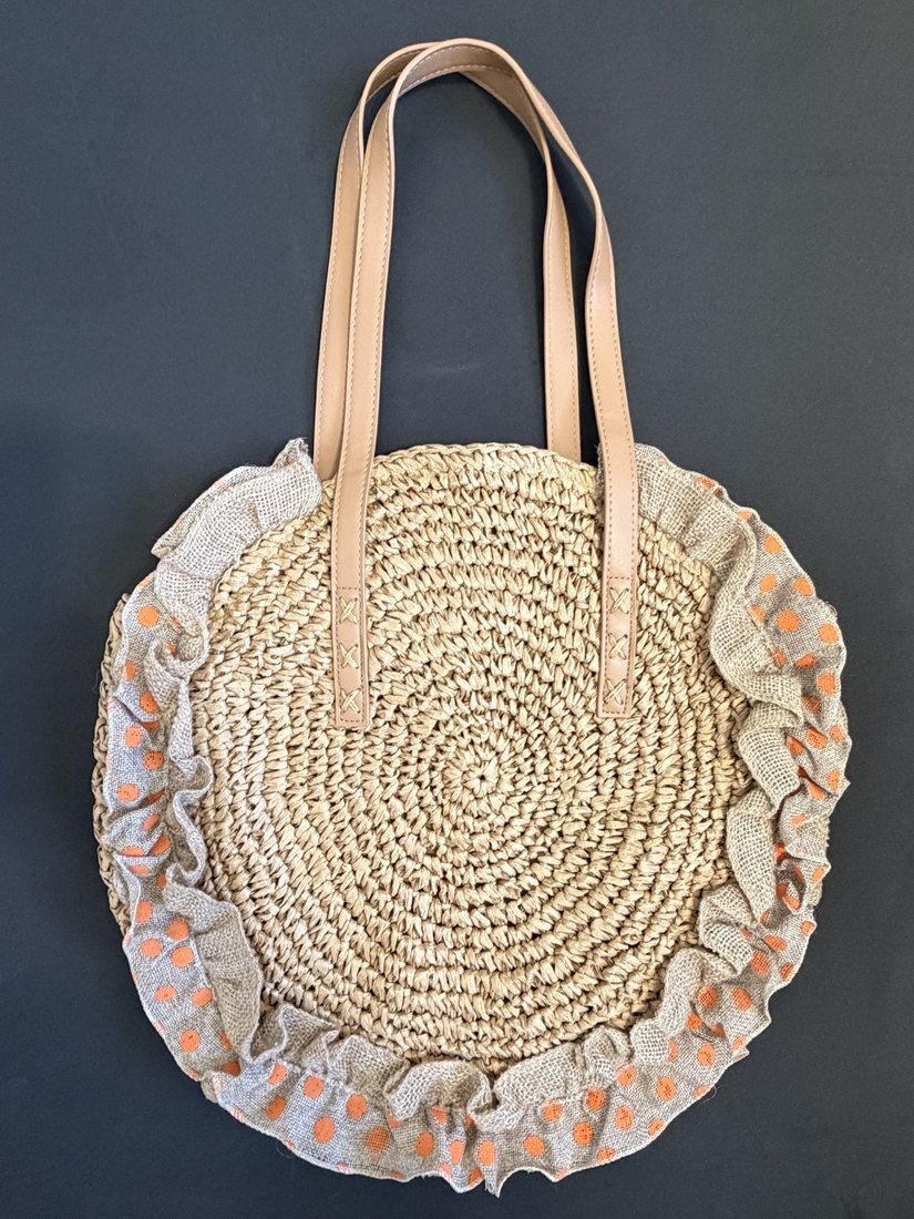 Bolso redondo tejido de material natural