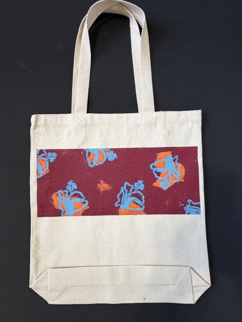 Bolso artístico de lona con estampado original burdeos, azul y naranja de Ramón